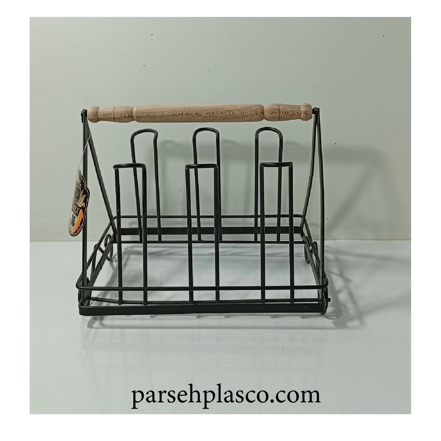 A cup holder on a wooden table. خرید جا لیوانی رومیزی